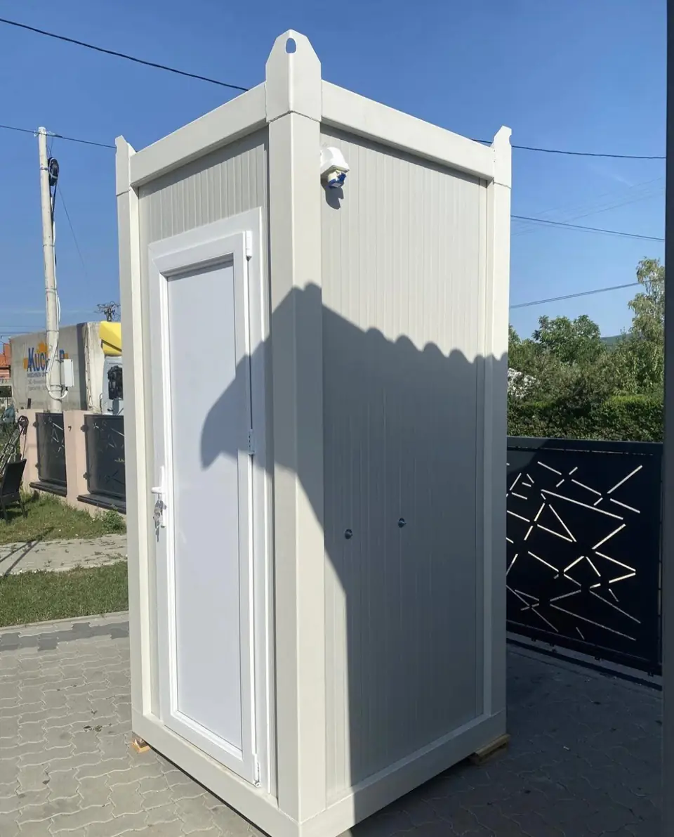 White single-stall flushing restroom cabin