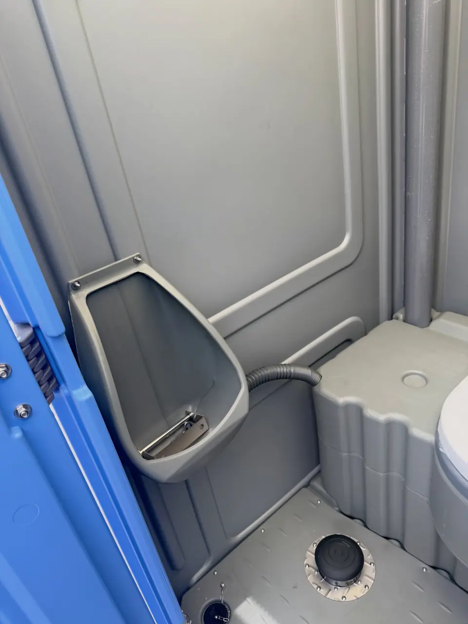 Urinal inside a porta potty